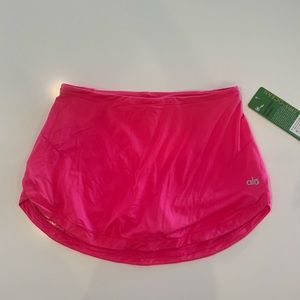NWT Alo- Practice A-line skirt with an elastic waistband. Neon Berry, size small
